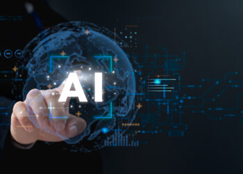 Un doigt touche une interface virtuelle marquée "AI" avec un globe terrestre en arrière-plan, symbolisant l’intelligence artificielle.